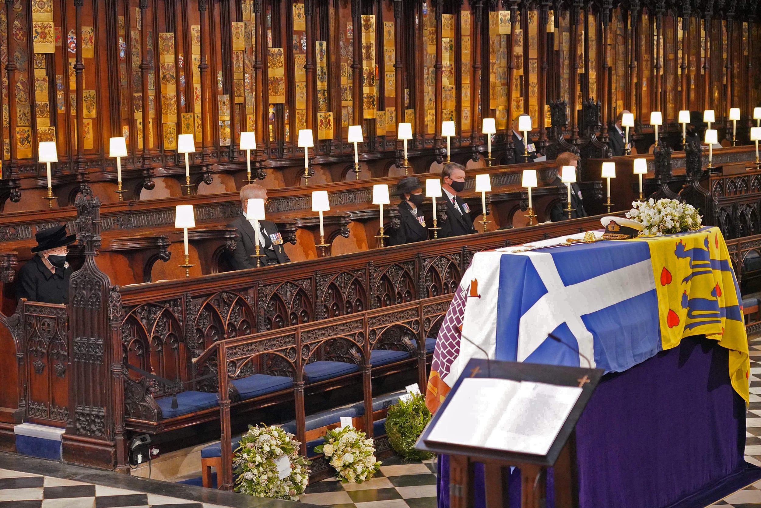 Image: Queen Elizabeth II looks at the coffin of Britain's Prince Philip, Duke of Edinburgh during his funeral service at St George's Chapel in Windsor Castle in Windsor, west of London, on April 17, 2021.