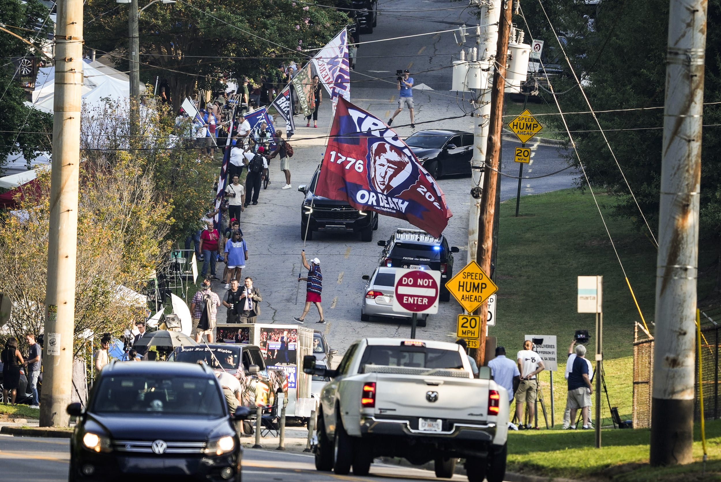 People around the Fulton County Jail intake center in Atlanta on the day former President Donald Trump plans to surrender to Atlanta authorities, on Aug. 24, 2023.