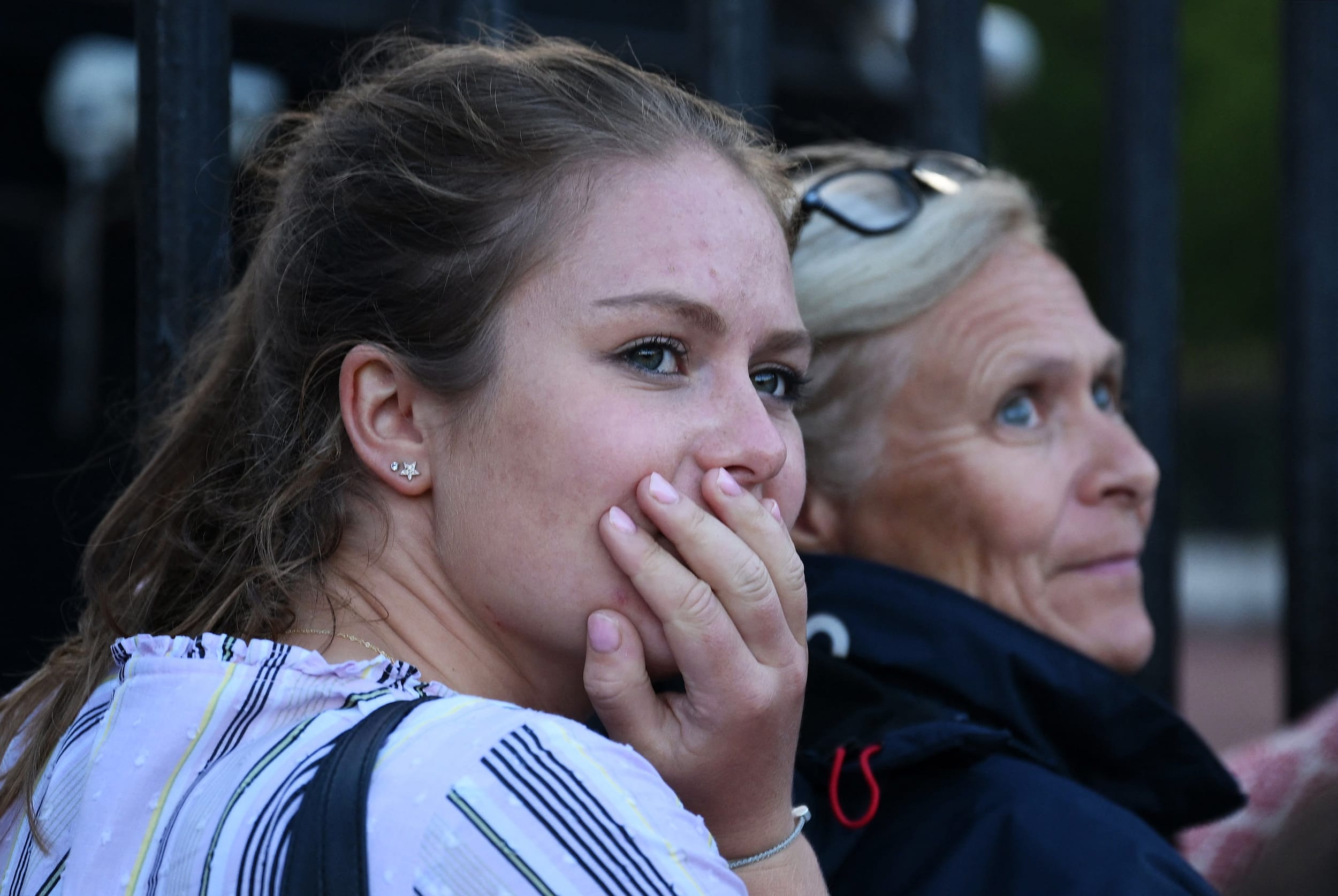 Image: People gather to pay their respects outside Buckingham Palace, after the announcement of the death of Queen Elizabeth II on Thursday.