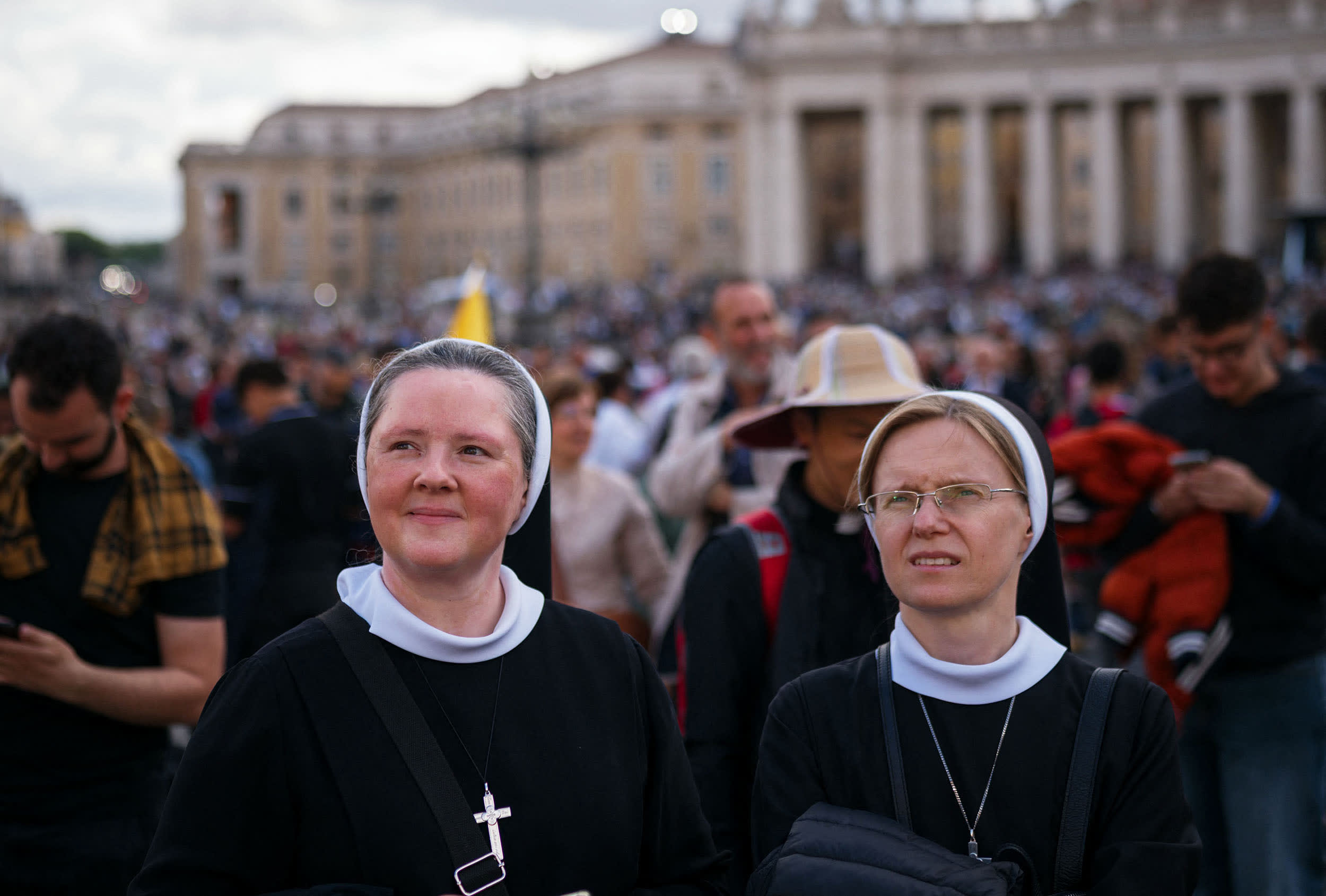 Two nuns stand on St Peter's Square after black smoke billowed from a chimney over the Sistine Chapel