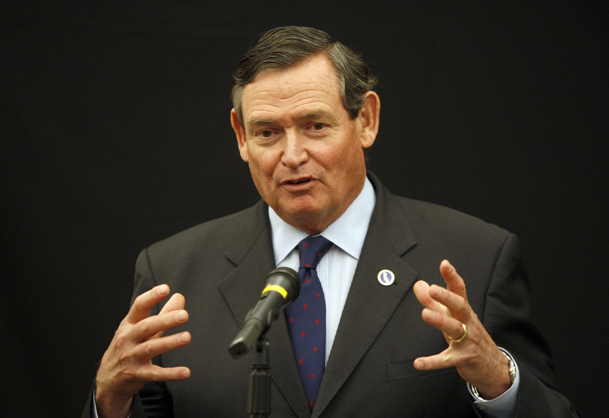 Image: Timothy P. White answers reporters' questions