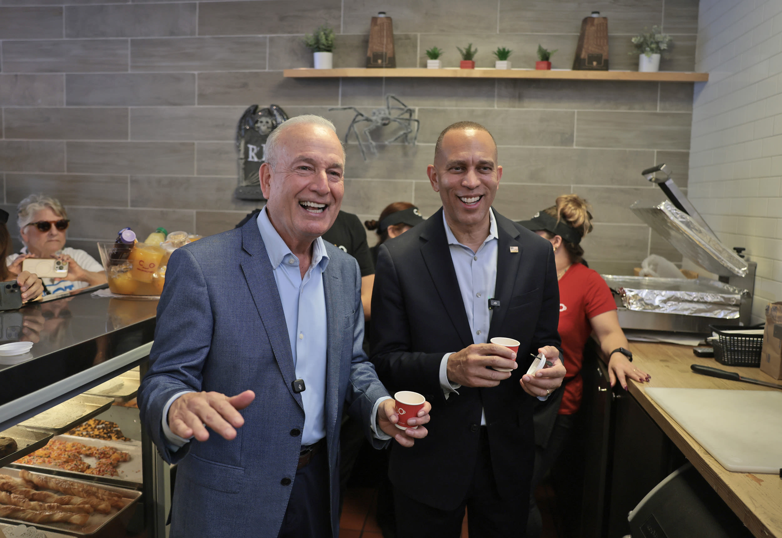 Florida Democratic Congressional candidate Eliott Rodriguez and House Minority Leader Hakeem Jeffries enjoy a Cuban coffee at the CAO Bakery and Cafe in Miami.