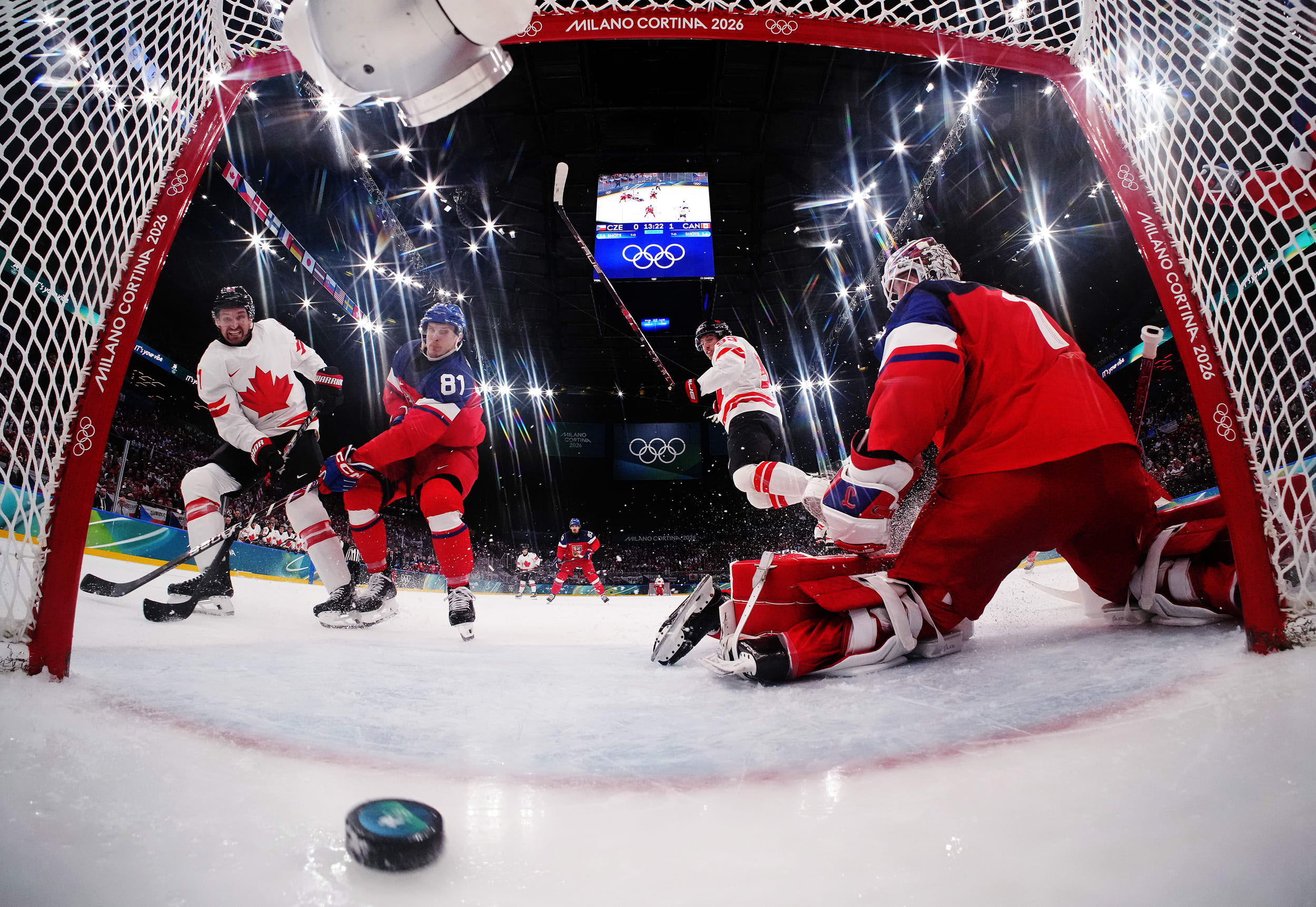 Mark Stone of Canada scores a goal past Dominik Kubalik and Lukas Dostal of Team Czechia in the second period during the Men's Preliminary Group A match between Czechia and Canada on day six of the Milano Cortina 2026 Winter Olympic games at Milano Santagiulia Ice Hockey Arena on February 12, 2026 in Milan, Italy.