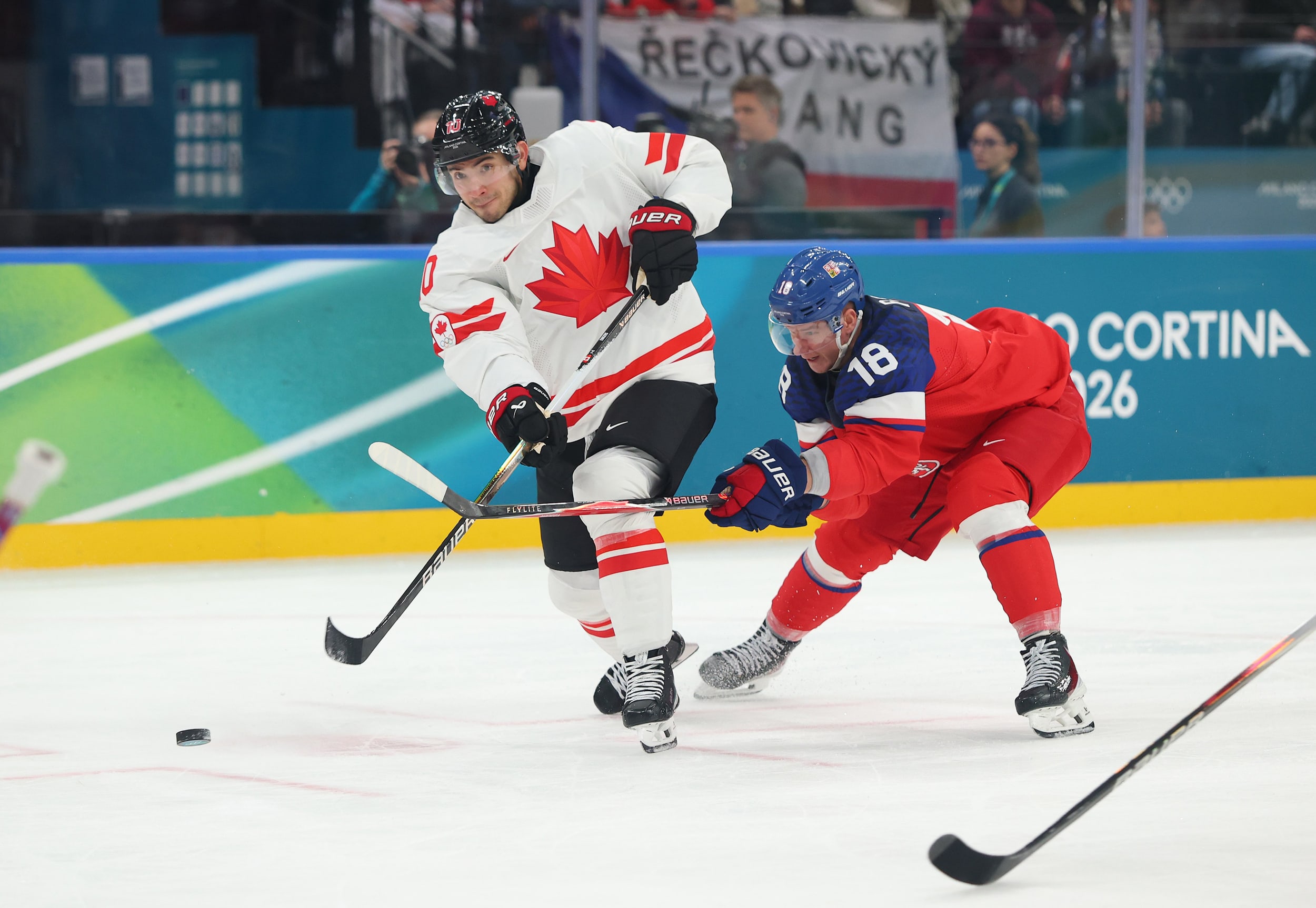 Nick Suzuki of Canada shoots the puck against Czechia at Milano Rho Ice Hockey Arena on February 12, 2026 in Milan.