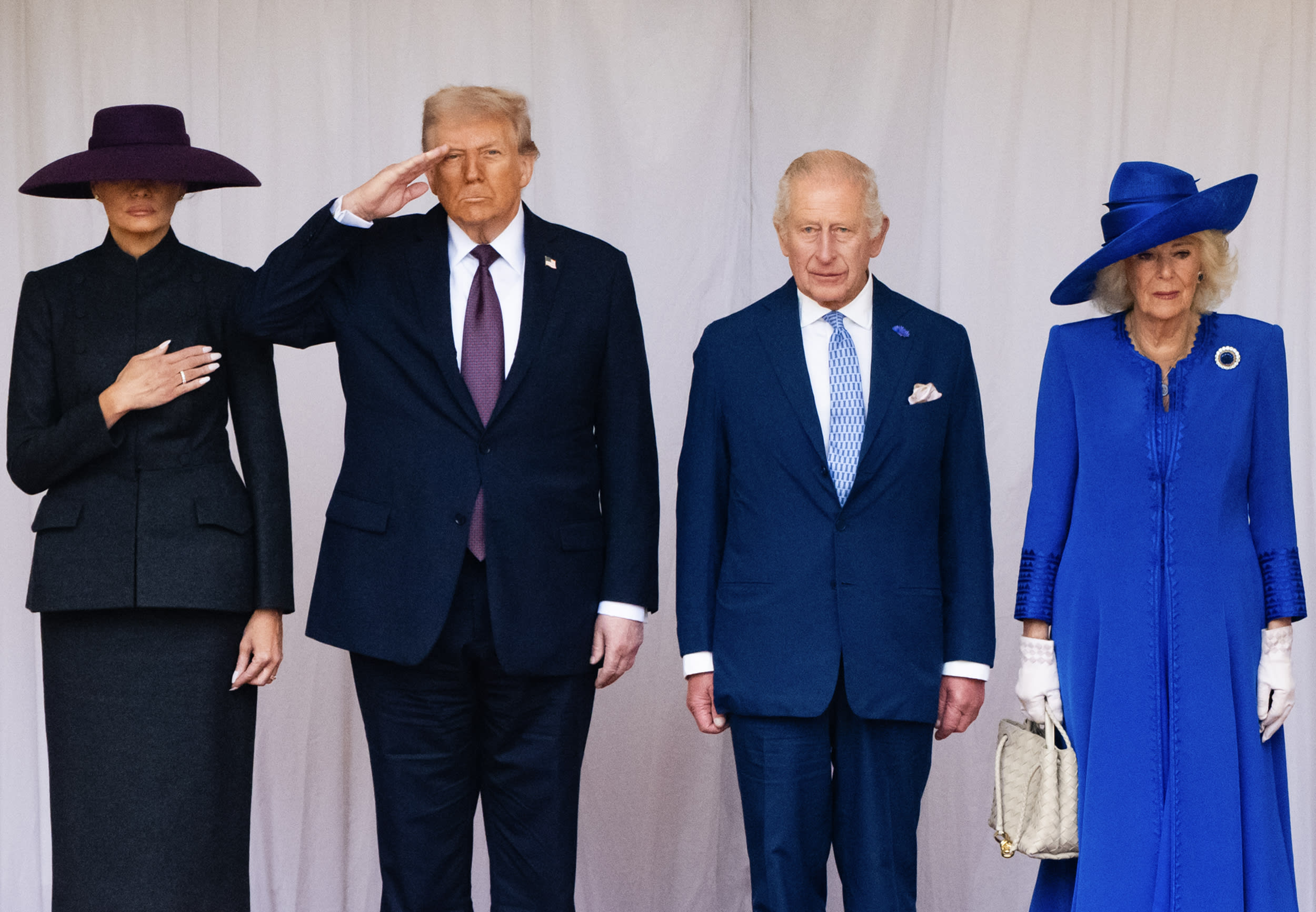 Melania and Donald Trump stand next to King Charles and Queen Camilla.