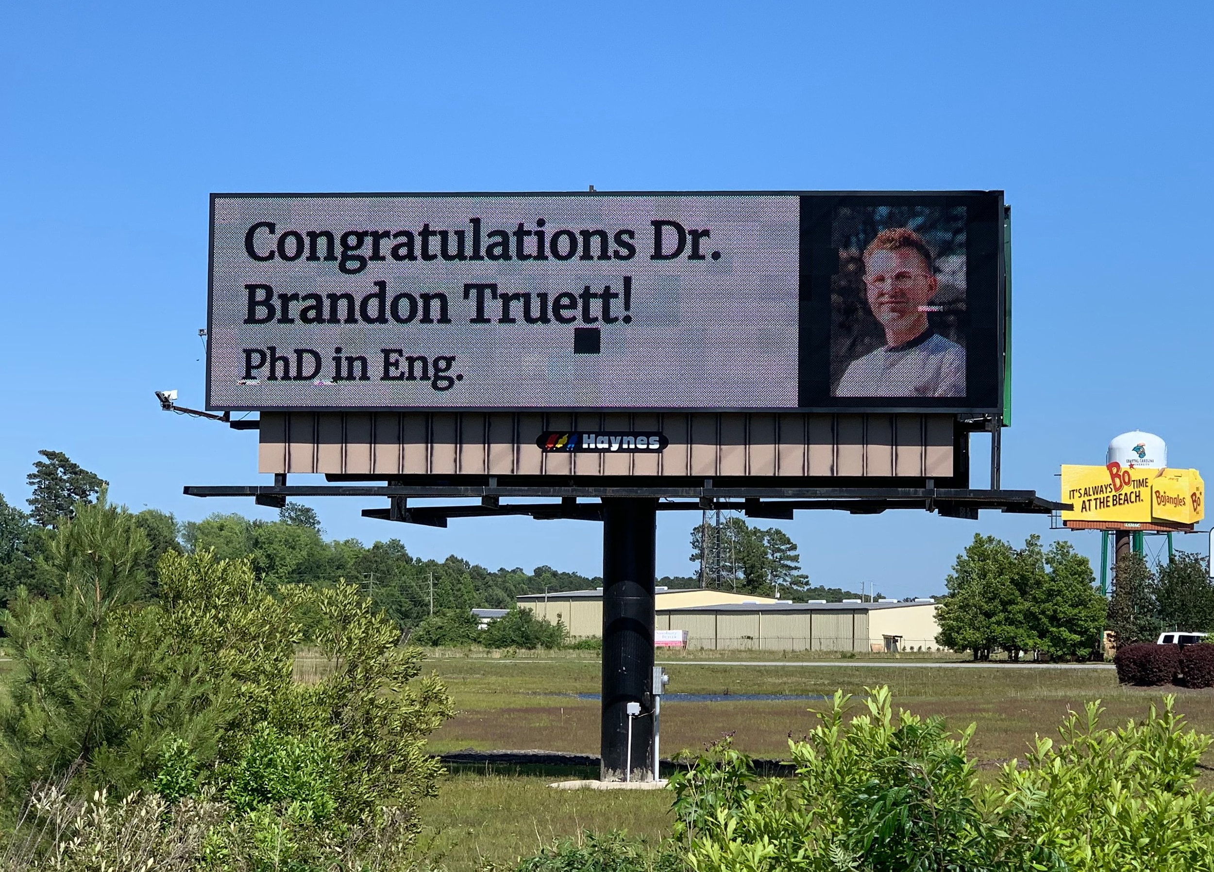Brandon Truett's parents celebrated his PhD on a billboard