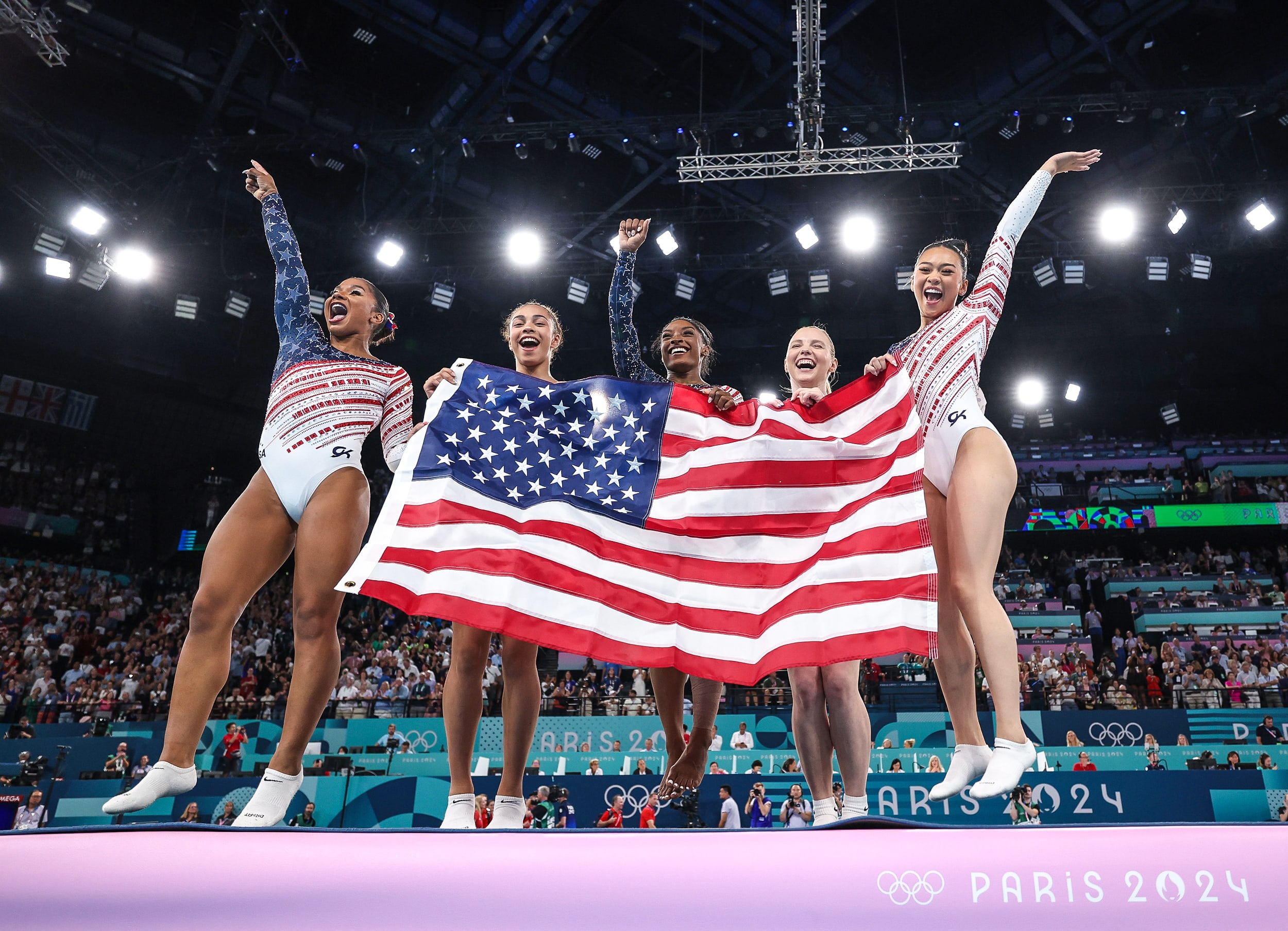 Image: Team United States celebrate winning the gold medal during the Artistic Gymnastics Women's Team Final