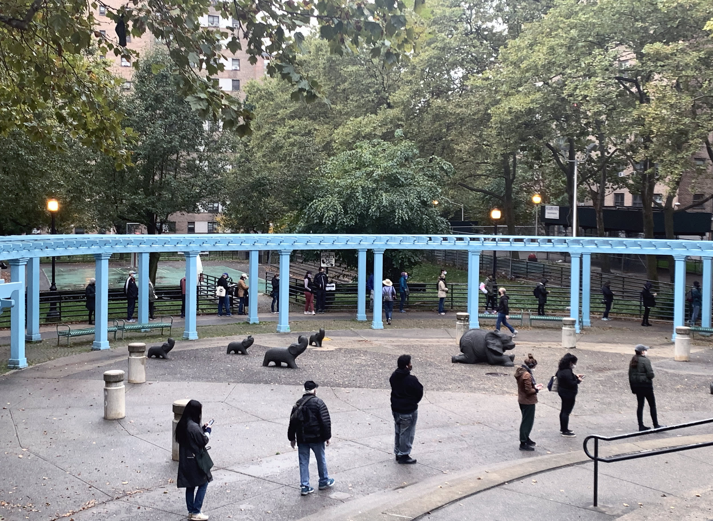 Voters wait in line to cast their ballot on day three of early voting in New York City on Oct. 26, 2020.