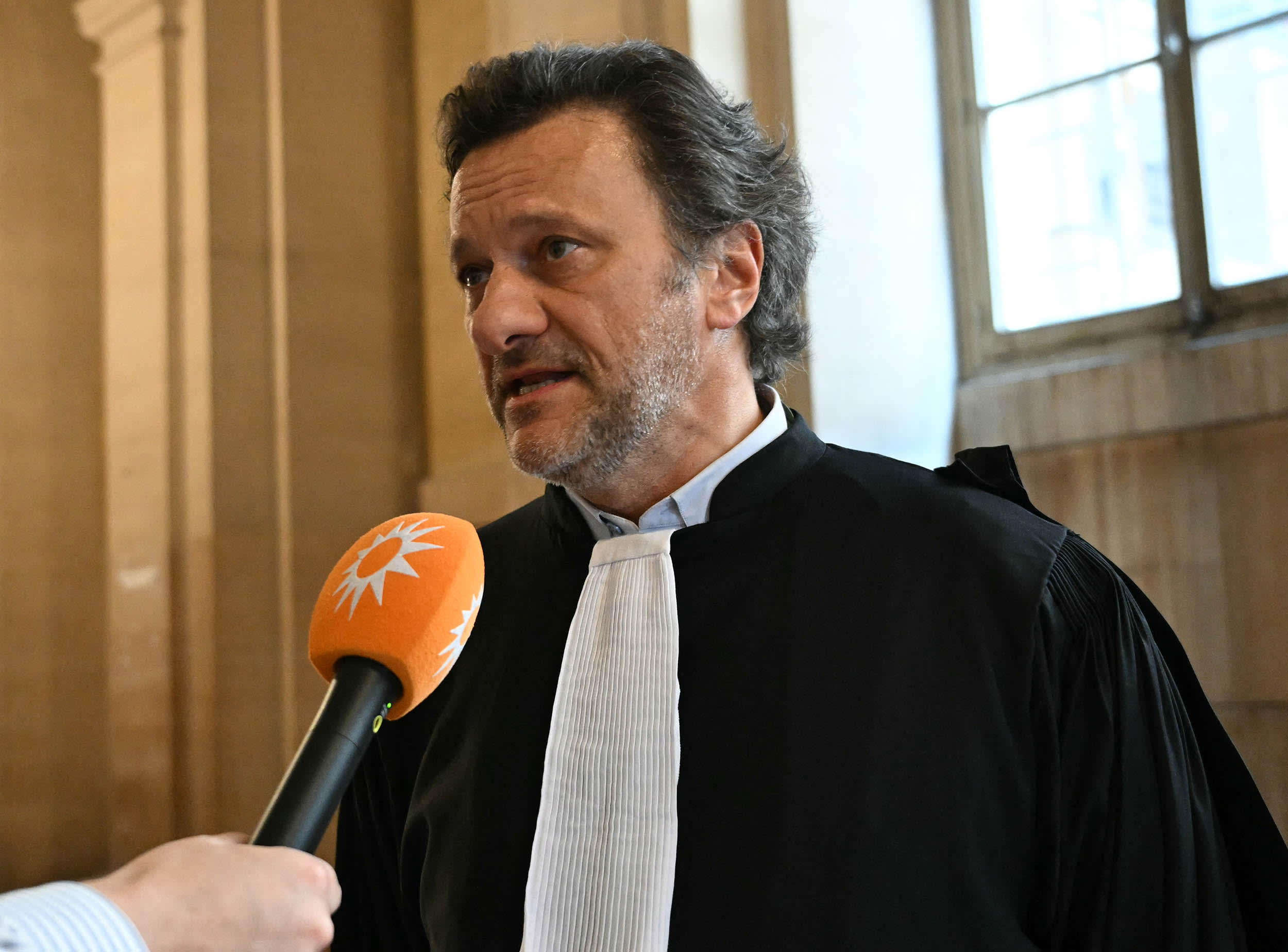 Arthur Vercken, lawyer of defendant Gary Madar, speaks to the press