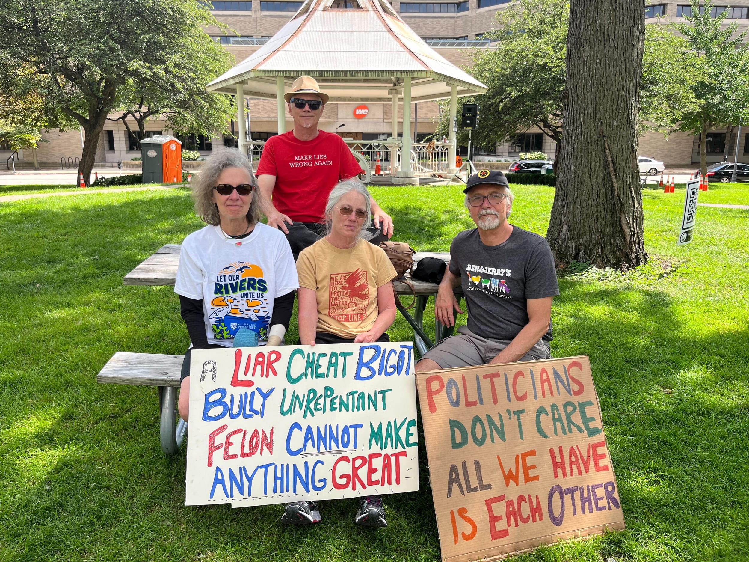 Clifford Lee Johnson, in red, and three of his friends protest in Zeidler Union Square Park.