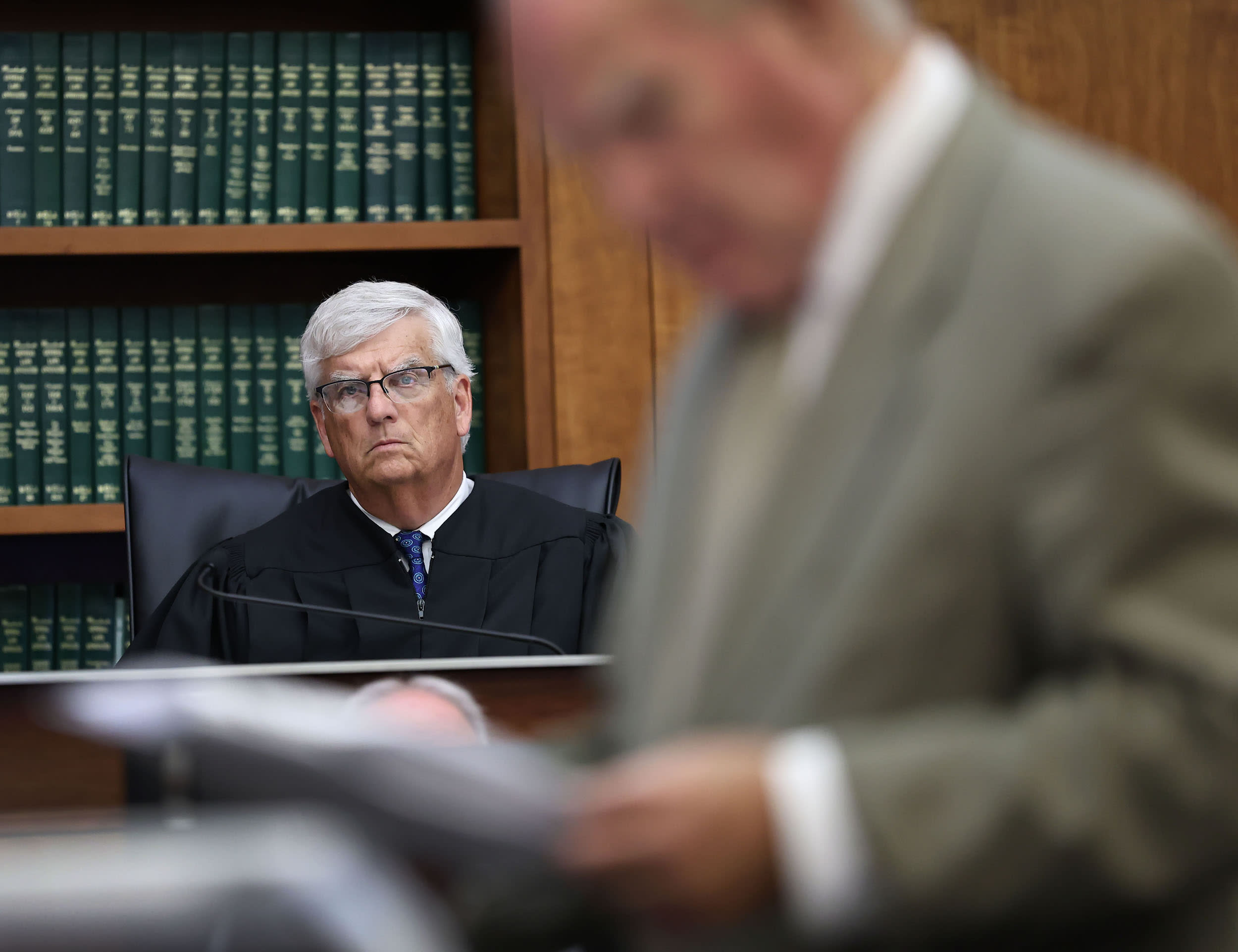 Judge William Sullivan listens to attorney Kevin Reddington 