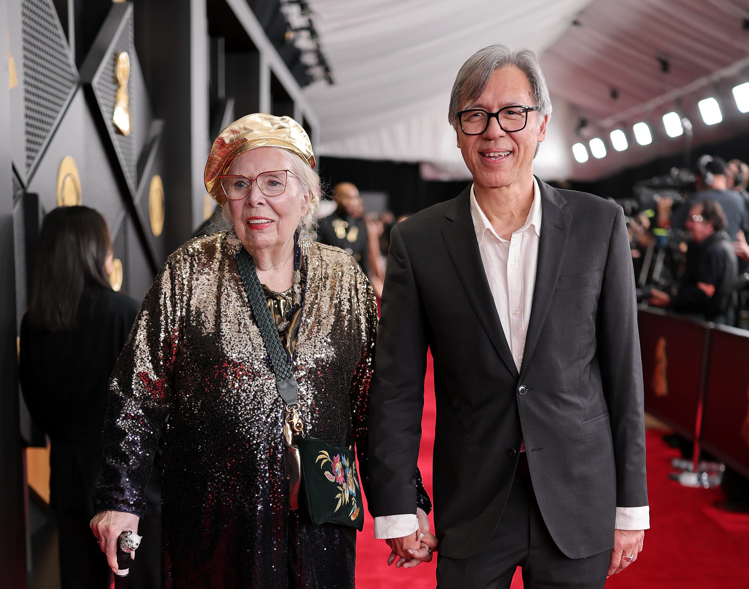Joni Mitchell arrives on a red carpet to the 68th GRAMMY Awards.