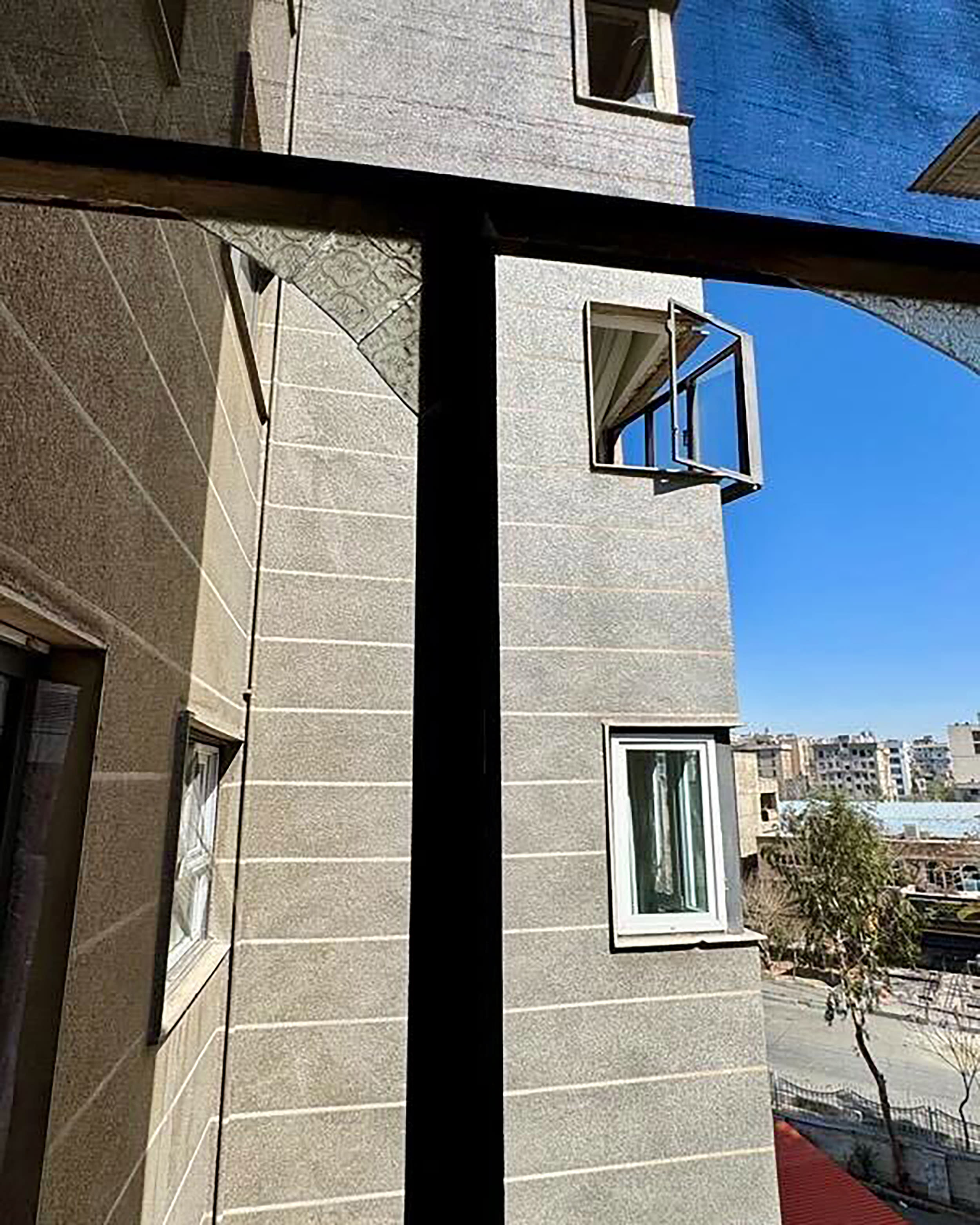 Damage inside residence in Marzdaran, west Tehran on Friday after a police station was targeted in the local area. 
