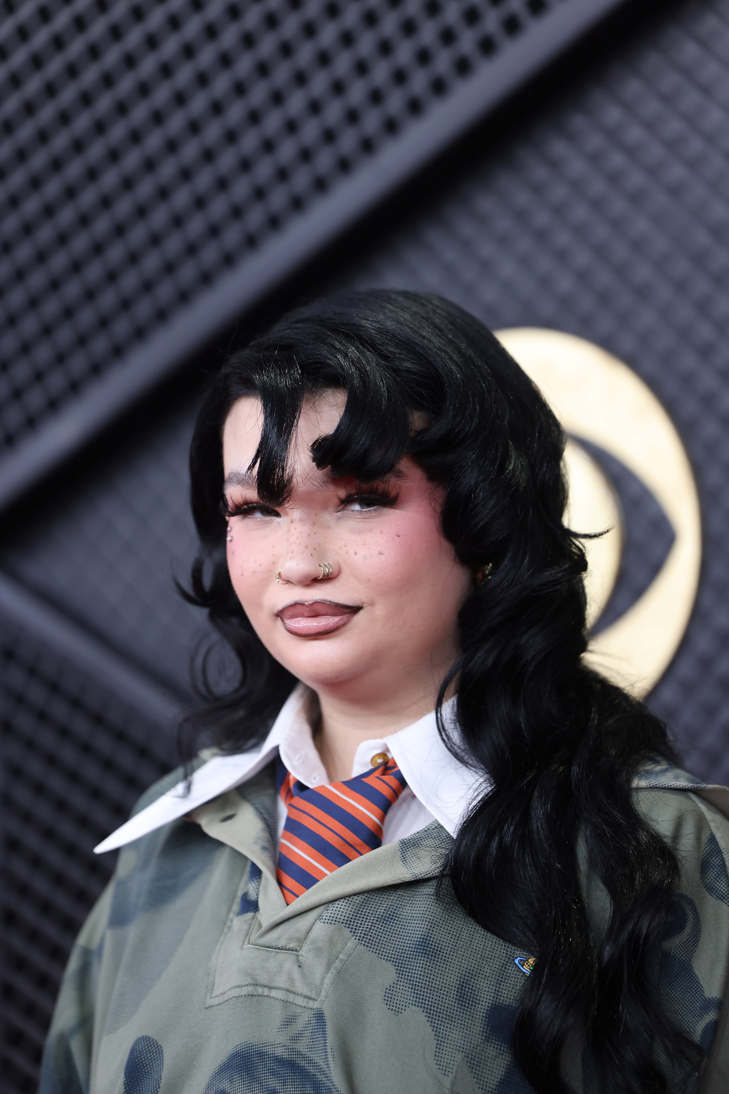 Best New Artist nominee Lola Young arrives on the carpet.