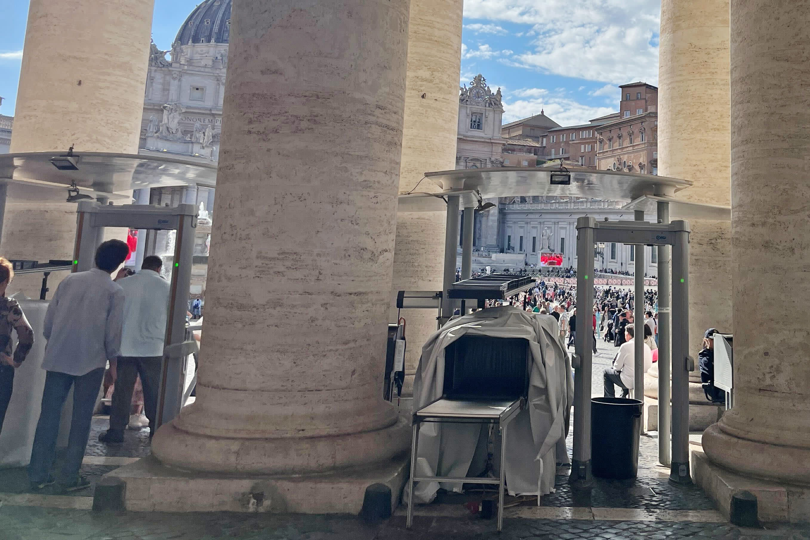 Visitors pass through scanners as they enter St. Peter’s Square at the Vatican on May 7, 2025.