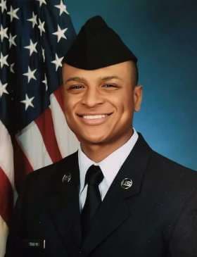 Tyler H. Simmons smiles in a portrait