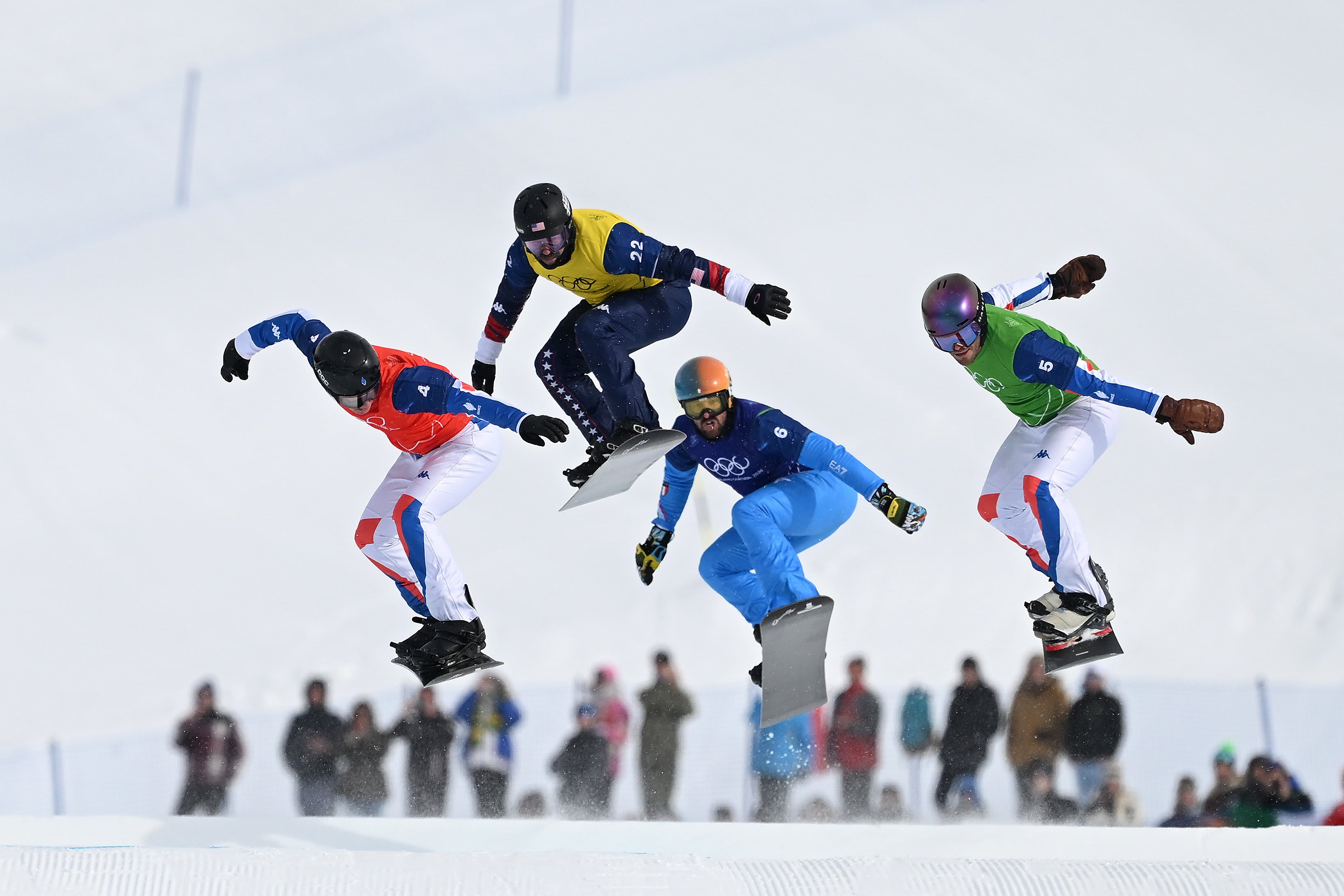 Jonas Chollet of France, Nick Baumgartner of the U.S., Lorenzo Sommariva of Italy and Loan Bozzolo of France compete during the men's snowboard cross small final at Livigno Snow Park on February 12, 2026 in Livigno, Italy.