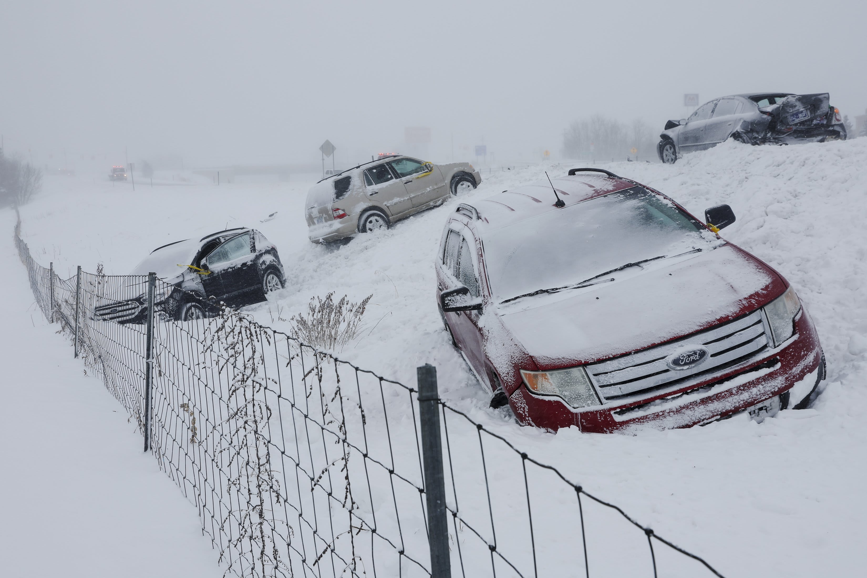 Vehicles sit along U.S. 131 in Byron Center, Mich. on Friday, Dec. 23, 2022.