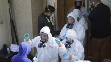 Video time-lapse shows cleaning crew’s long exit from facility with COVID-19