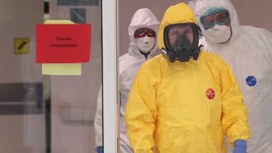Watch: Putin dons hazmat suit to visit hospital treating coronavirus patients
