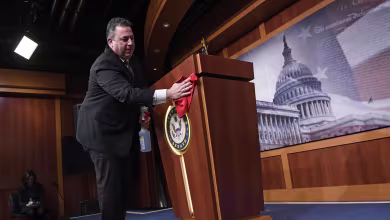 Watch: Podium is wiped clean before McConnell's presser on coronavirus relief