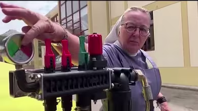Nun drives farm tractor spreading disinfectant to combat COVID-19