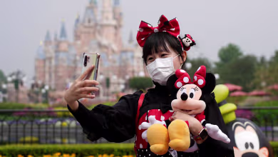 Disneyland Shanghai reopens with dancing, catchy rhythms — and face masks