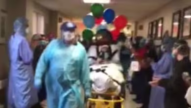 Front line staff cheer on discharged COVID-19 survivor after 44 days in hospital