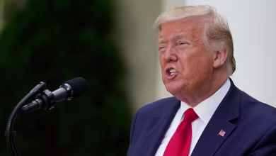 Trump denies criticizing Biden for wearing face mask, asks reporter to take his off