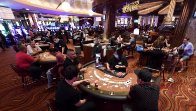 Revelers return to Las Vegas casinos after coronavirus closure ends