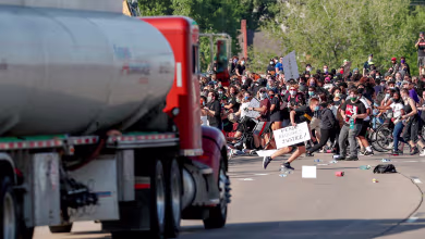 Cameras capture video of truck driving through crowd of protesters on highway