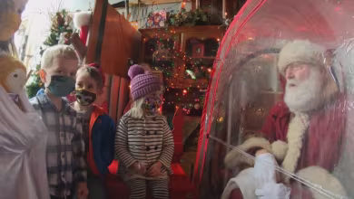 Amid Covid pandemic, Oregon Santa Claus greets children from the safety of his own bubble