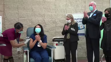 Watch: New Jersey nurse receives state's first Covid vaccination