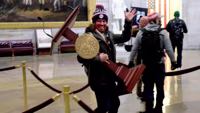 Watch: Man pictured carrying Pelosi’s lectern booked at police station