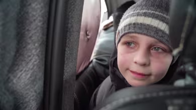 WATCH: Ukrainian child describes leaving father behind as he flees country