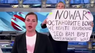 Watch: Protester with 'No War' sign walk onto Russian state TV set