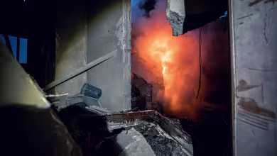 At least one killed after downed rocket fell on Kyiv apartment building, emergency services say