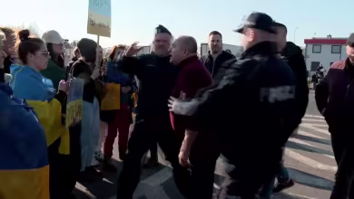 Angry truck drivers confront protesters at Poland-Belarus border