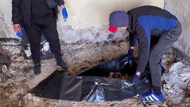 Workers recover charred remains of Holocaust survivor killed in Kharkiv