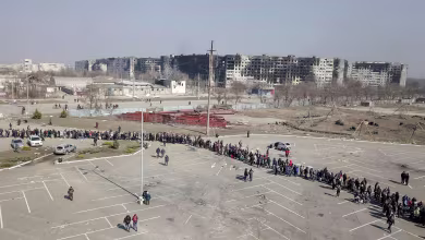 Drone video shows long lines waiting for aid handouts in Mariupol