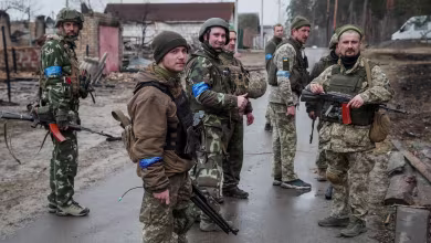 Ukrainian soldiers patrol Kyiv outskirts recaptured from Russia troops