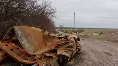 Ukrainians clear Russian wreckage outside Kyiv as front line moves east
