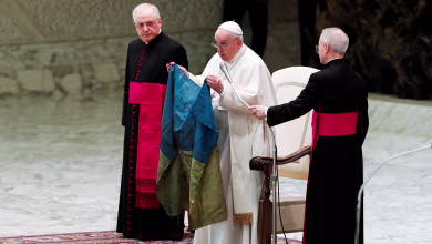 Pope Francis holds Ukrainian flag from ‘martyred’ city of Bucha