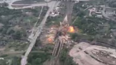 Ukrainian fighters destroy bridge to slow Russian advance