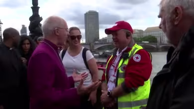 Archbishop of Canterbury greets mourners waiting to see Queen Elizabeth lie in state