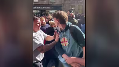 Watch: Protester dragged from crowd after heckling Prince Andrew