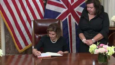 Nancy Pelosi signs book of condolence following the death of Queen Elizabeth II