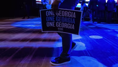 Warnock and Walker advancing to runoff in Georgia Senate race