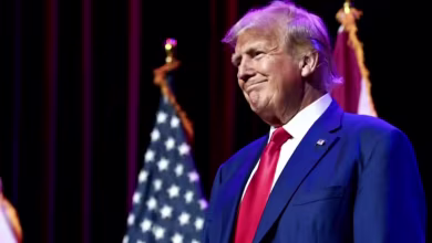 Trump co-defendants start to surrender in Georgia