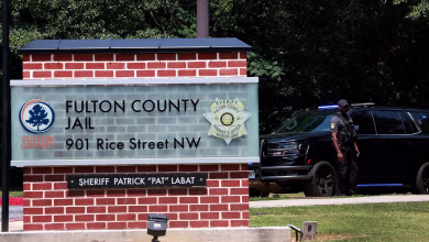 Four more Trump co-defendants surrender in Fulton County